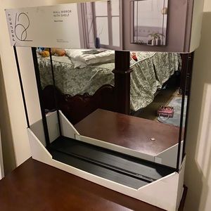Wall mirror with shelf